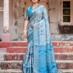 Ralphdavinci Aqua Blue Banarasi Silk Saree with Zari Border, Floral Motifs, and Tassels